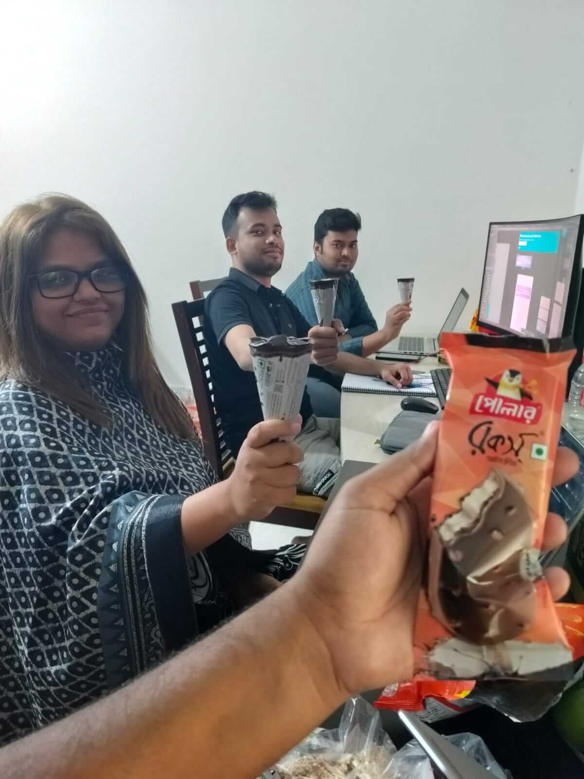LozicLabs teammates sharing ice cream